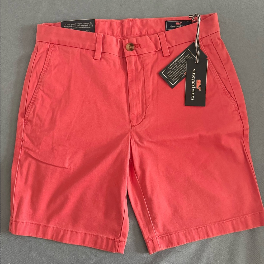 Vineyard vines matches red Breakers shorts.